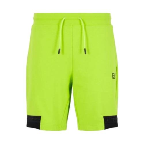 Fluorescerende gule shorts med kontrastdetaljer