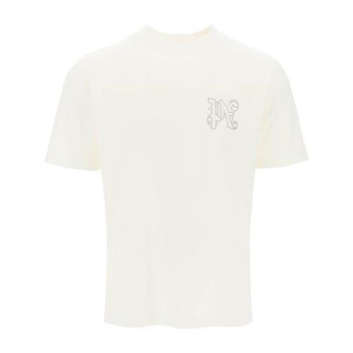 T-shirt med nitter og monogram